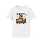 A white short-sleeve crewneck t-shirt featuring a cartoon graphic of a capybara relaxing in a hot tub with the text 'YOUR URGENCY IS NOT MY EMERGENCY'.