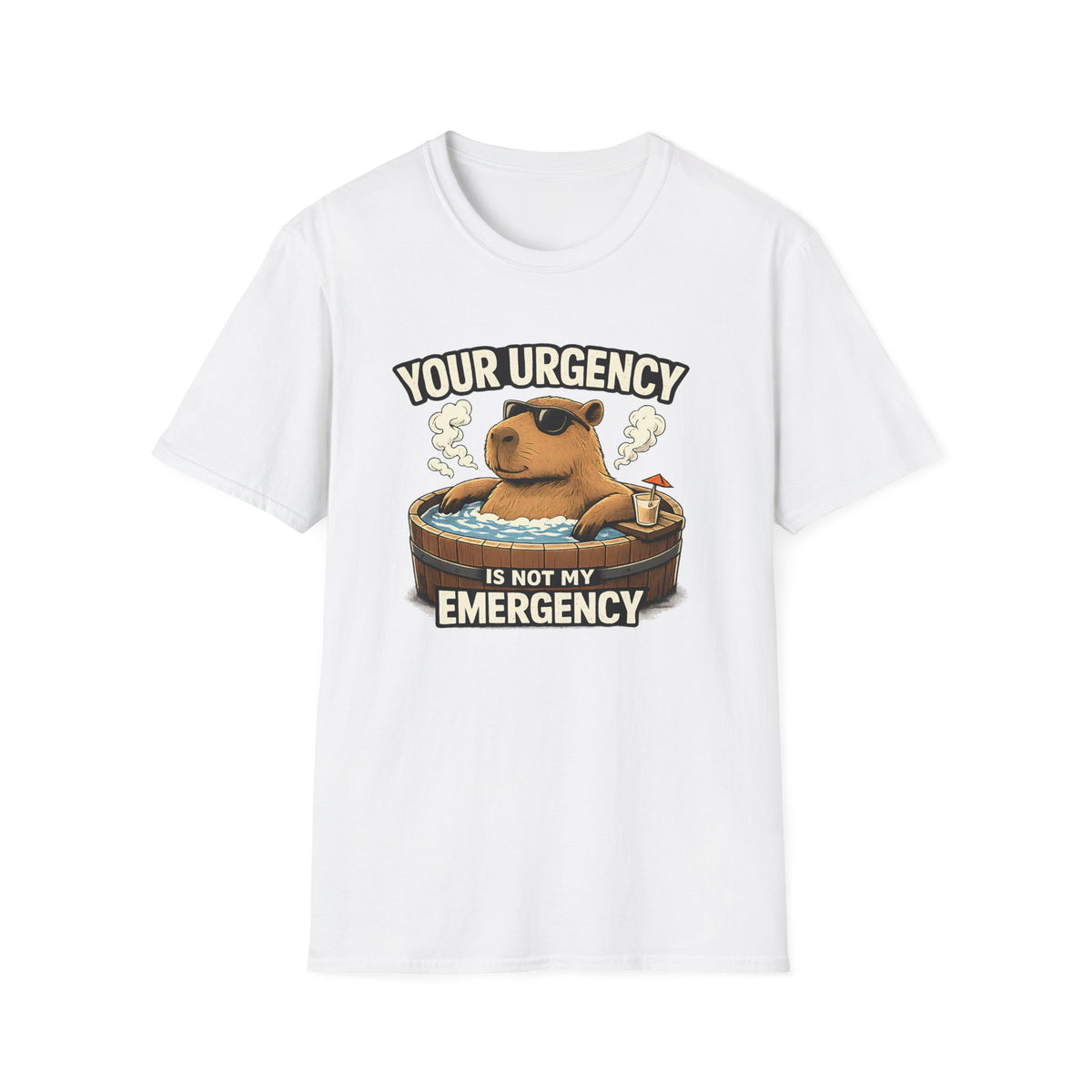 A white short-sleeve crewneck t-shirt featuring a cartoon graphic of a capybara relaxing in a hot tub with the text 'YOUR URGENCY IS NOT MY EMERGENCY'.