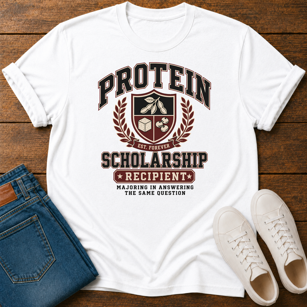 white t-shirt with Vintage collegiate crest design reading “Protein Scholarship Recipient” with soybean, tofu, and bean illustrations and the words “Majoring in Answering the Same Question.”